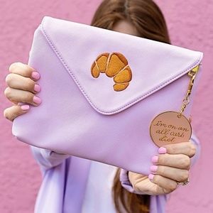 Studio Diy croissant clutch with Keychain flair.